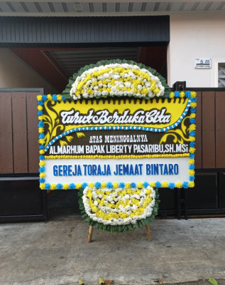 Papan Bunga Duka di Jair